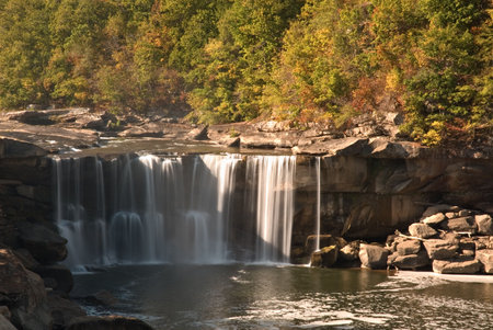 Cumberland falls in Kentucky.  This waterfall  is located near the city of Corbin in Cumberland falls state park.  Photo was taken in mid October during a drought. Even with a drought the waterfall is impressive. の写真素材