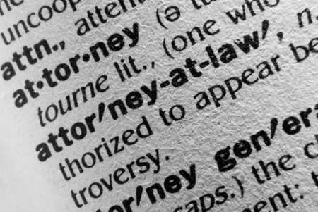 A macro photo of the definition of the word Attorney and Attorney at Law. Lots of texture in the...