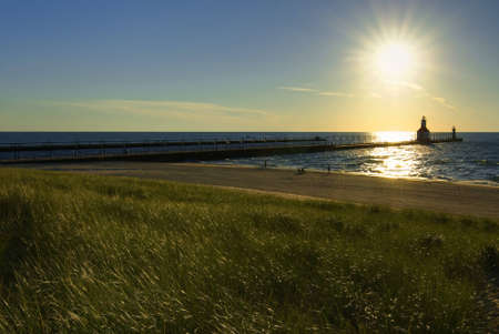 St. Joseph North Pier Lights in St. Joseph, Michigan at sunset.の写真素材