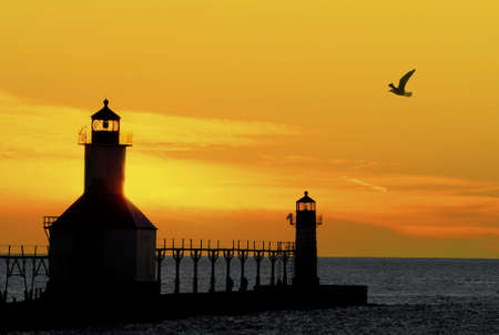 St. Joseph North Pier Lights in St. Joseph, Michigan at sunset.の写真素材