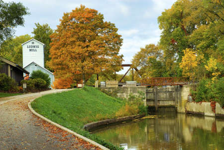 The Historic Ludwig Mill surrounded by peak fall colors in Toledo Ohio  Itの写真素材