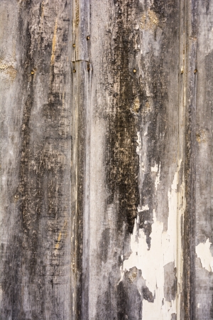 Close up high resolution photo of an old barn with peeling paint.. Great for backgrounds and overlays to add a grungy texture to your photos.の写真素材
