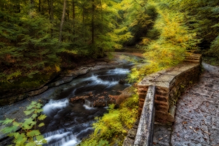 A series of small waterfalls in Filmore Glen New York during fall. I've applied photoshop effects...
