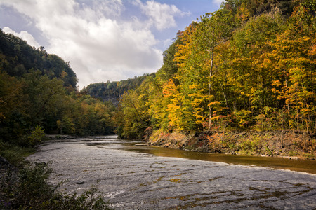 A beautiful winding river lined with trees in autumn  Located in the Finger Lakes region in New York state の写真素材