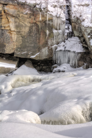 Photo of  icicles on a sandstone wall at Berea Falls Ohio during winter.の写真素材