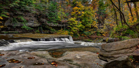 Beautiful autumn scene at The Great Falls of Tinker's Creek Gorge in Cleveland Ohio.の写真素材