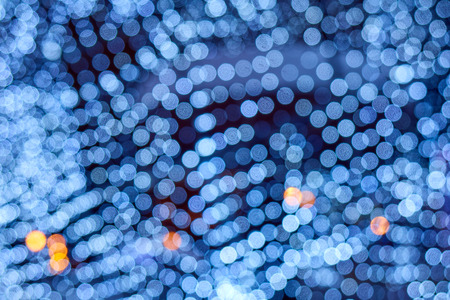 Blue blur background, neon illumination, many small bokeh circles with some orange dots texture,...