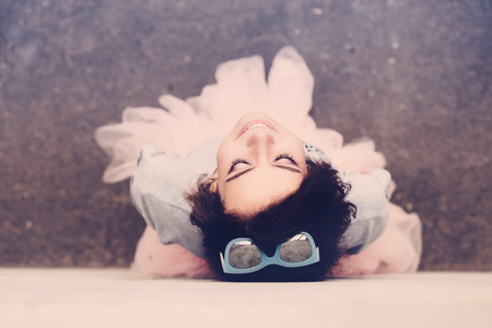 Beautiful young brunette posing as a ballerinaの写真素材