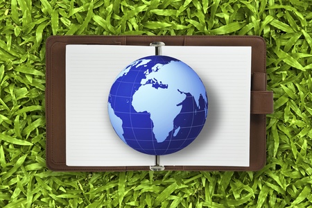 Globe on the book  lawn background : Data source: NASA の写真素材