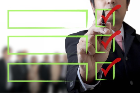 Businessman drawing a graph on the boardの写真素材