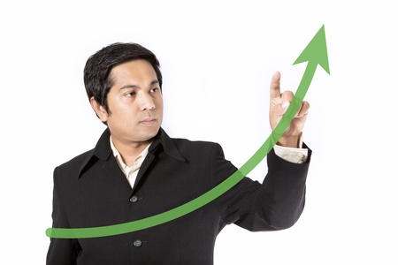 Businessman drawing a graph on the boardの写真素材