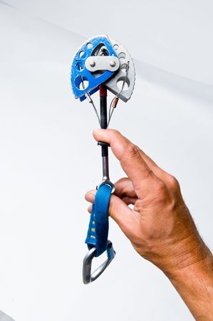 A rock climbing cam in a man's handの写真素材