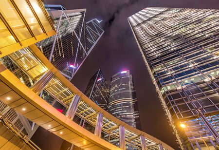 Glass & Steel Skyscrapers and Bridge with Reflections at Night, Hong Kong