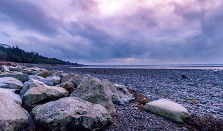 Tranquil and Serene Irish Coast and Sea under Colourful Sunset, County Down, Northern Irelandの写真素材
