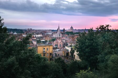 Panoramic View across Rooftops of Rome and St Peter's at Magenta Sunset, Rome, Italy