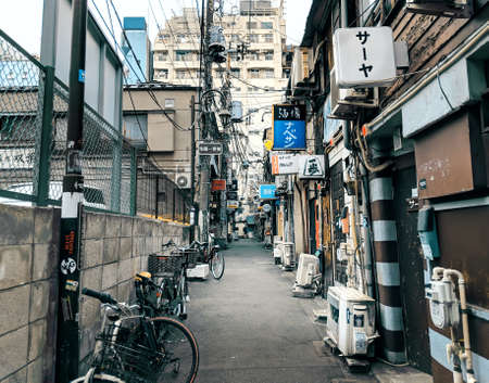 Tokyo - 26 March 2019 - View of Grungy Japanese Style Alleyway with Bars at Golden Gai in Tokyo, Japanのeditorial素材