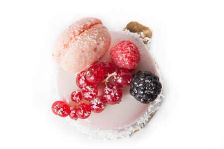 Sweet dessert with red currant berries on white