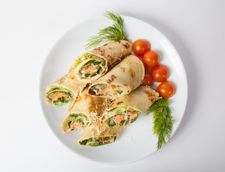 Fresh salmon spring rolls on a white plateの写真素材
