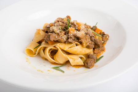 Tagliatelle with meat on a white backgroundの写真素材