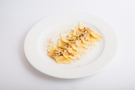 Sweet dessert ravioli served with almond nutsの写真素材