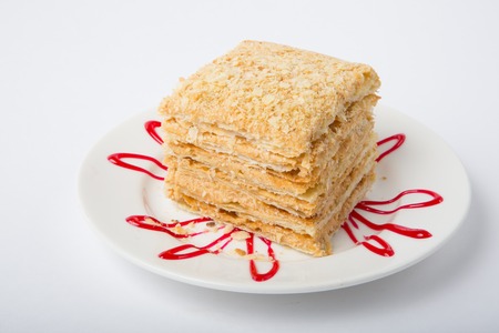 Piece of honey cake on a white plate