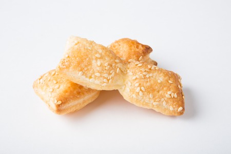 Freshly baked sticks with sesame seeds on white backgroundの写真素材