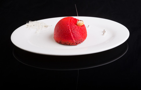 Red velvet dessert cake on black backgroundの写真素材