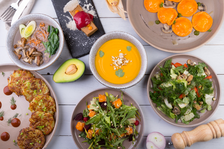 Set of different dishes served on a wooden table,の写真素材