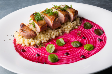 Grilled duck meat served with pasta and chukaの写真素材