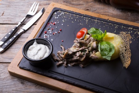 Beef stroganoff served with mashed potatoの写真素材