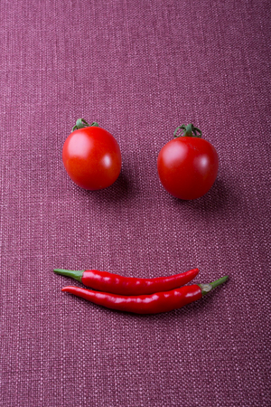 Funny face made from different vegetables and fruitsの写真素材
