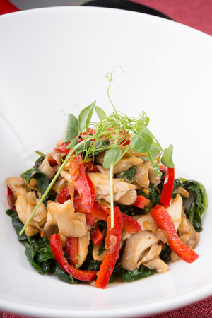 Fresh healthy spinach salad served with mushroomsの写真素材