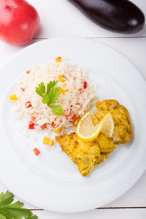 Cooked chicken with rice and served with pomegranateの写真素材