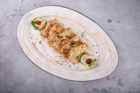 Chicken baked in almonds and served with steamed quinoa