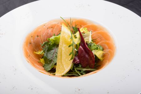 Smoked salmon salad served in a white bowl