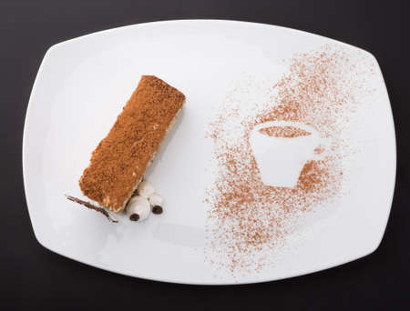 Sweet tiramisu cake dessert on white plate