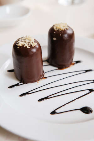 Dark chocolate desserts served on a white plate