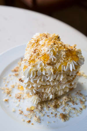 Whole neapolitan seafood pizza served on a marble cafe tableの写真素材