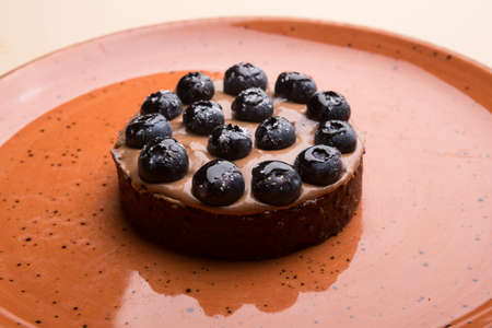 Round italian ravioli pasta served with green basil sauce and white cheeseの写真素材