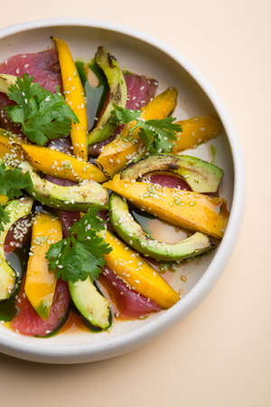 Tuna salad with avocado, mango and cilantroの写真素材