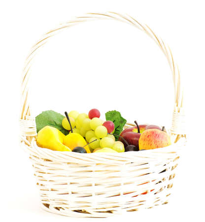 White basket with fruits isolated on whiteの写真素材