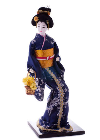 Statuette of geisha with flowers, isolated on whiteの写真素材