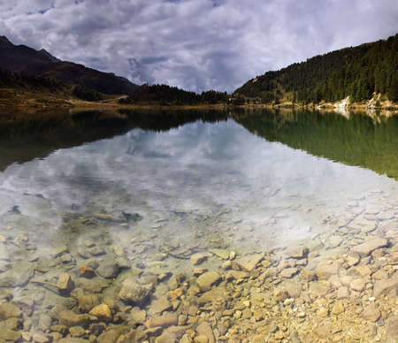 Panoramic view of lake in Austrian Alps, Tirolの写真素材