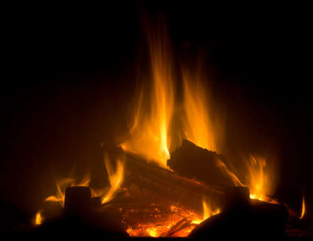 Flame of fireplace with black backgroundの写真素材