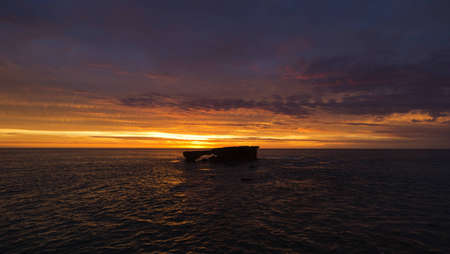 Ocean sunset with island, South Australiaの写真素材