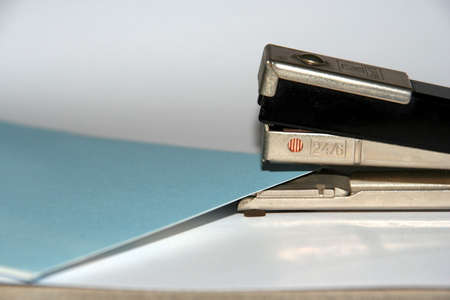 A stapler with some sheets to stapleの写真素材