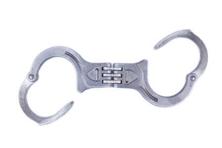 Metal handcuffs isolated on a white backgroundの写真素材