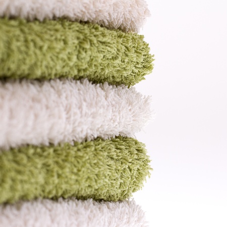 A pile of green and white towelsの写真素材