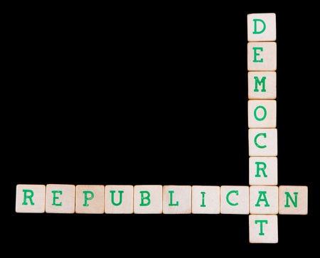 Democrat and republican spelled in a crossword on a black backgroundの写真素材
