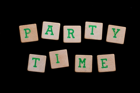Party time spelled out in old wooden blocksの写真素材